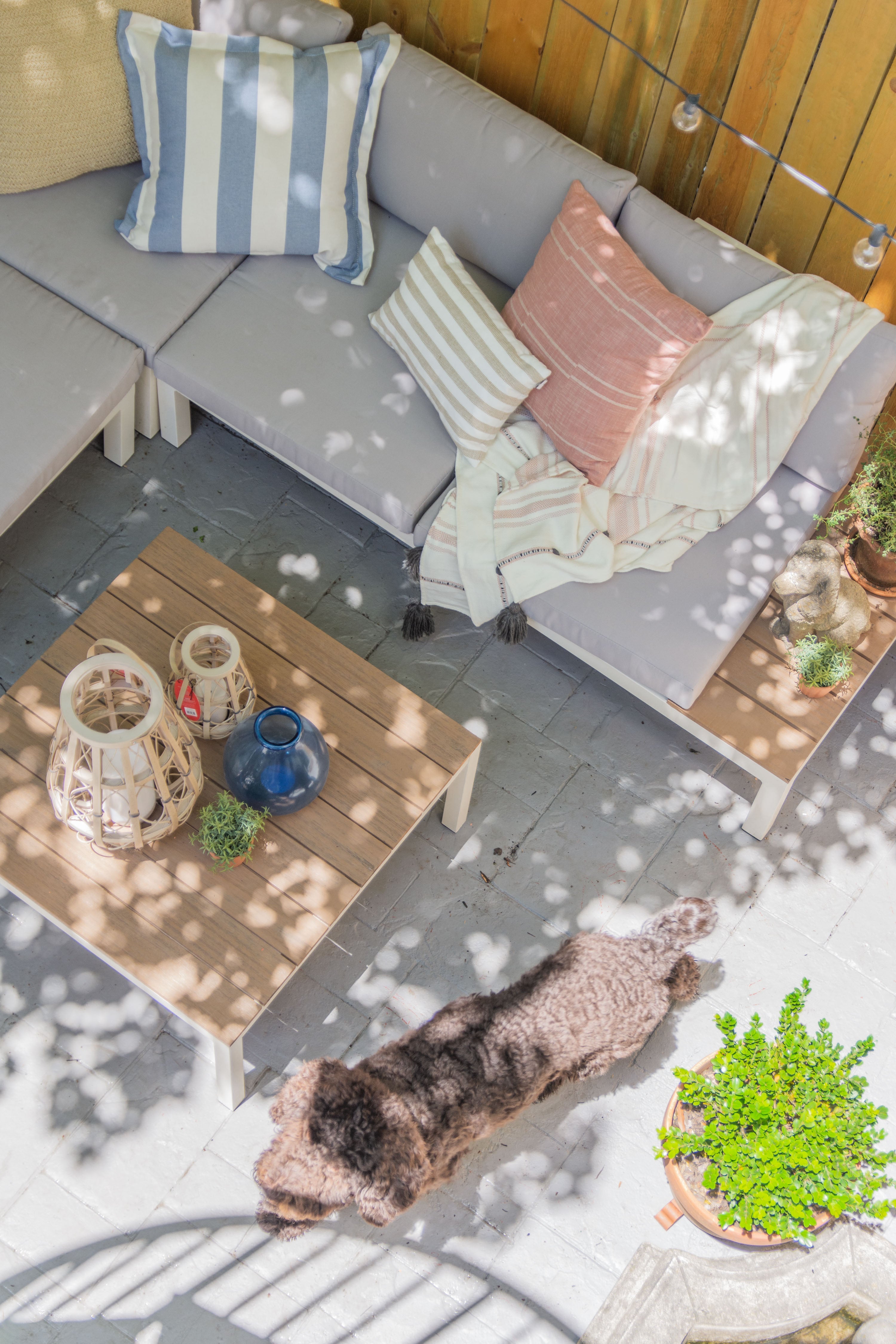 Spring patio design ideas with modern patio furniture sectional and potted garden on Thou Swell #patio #patioideas #patiodesignideas #patiodesign #patiofurniture #homedesignideas #patiodesignideas