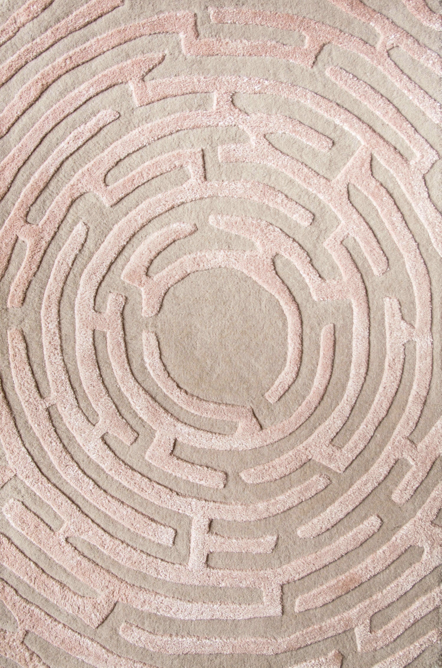 Maze luxury floor rug with a peony pink border outlining a beige maze