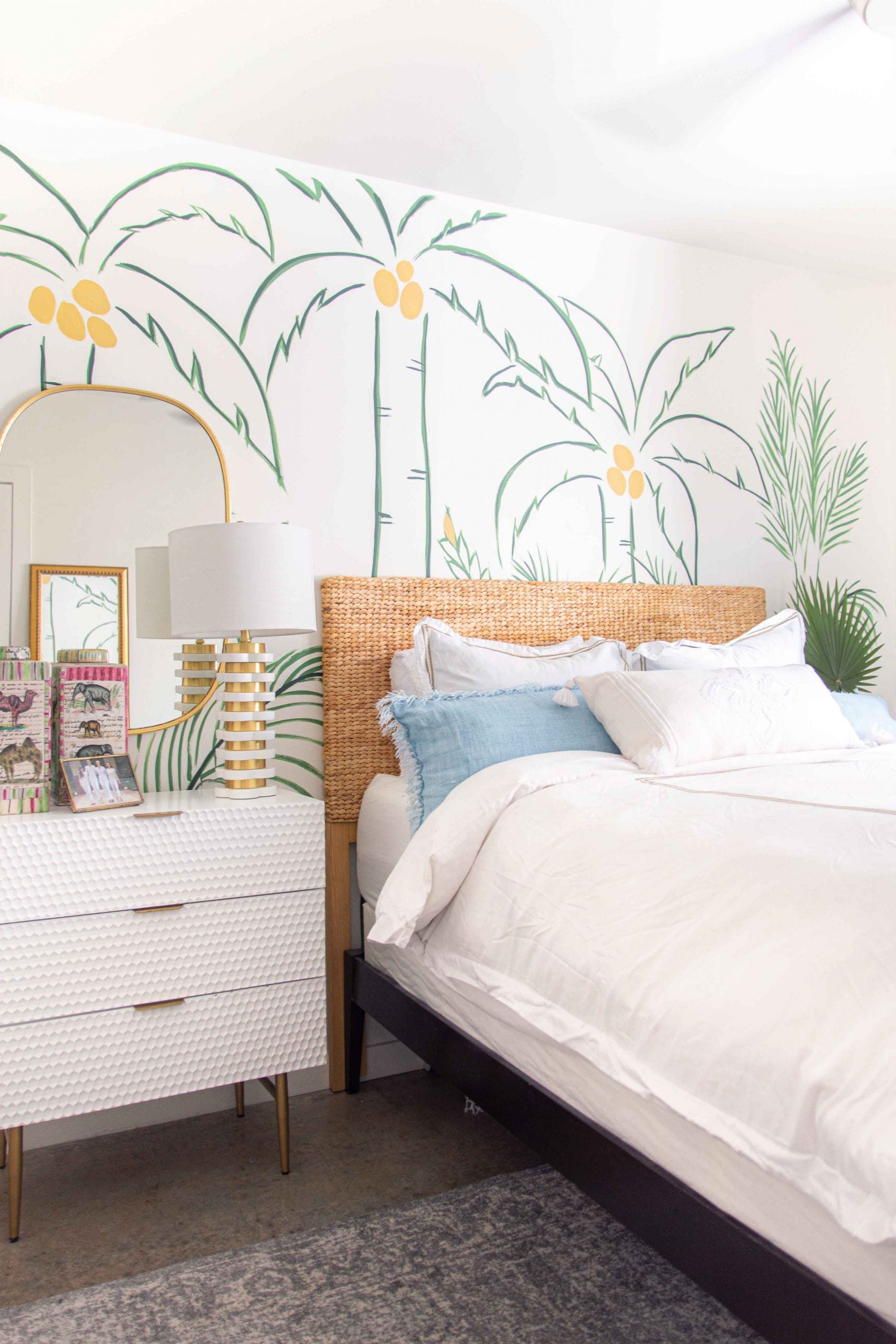 Hand-painted tropical wall mural with palm trees in green and white bedroom design by Kevin O'Gara on Thou Swell #wallmural #paintedmural #bedroomwall #bedroomdecor #bedroomdesign #tropicaldesign #tropicalwall #tropicalmural
