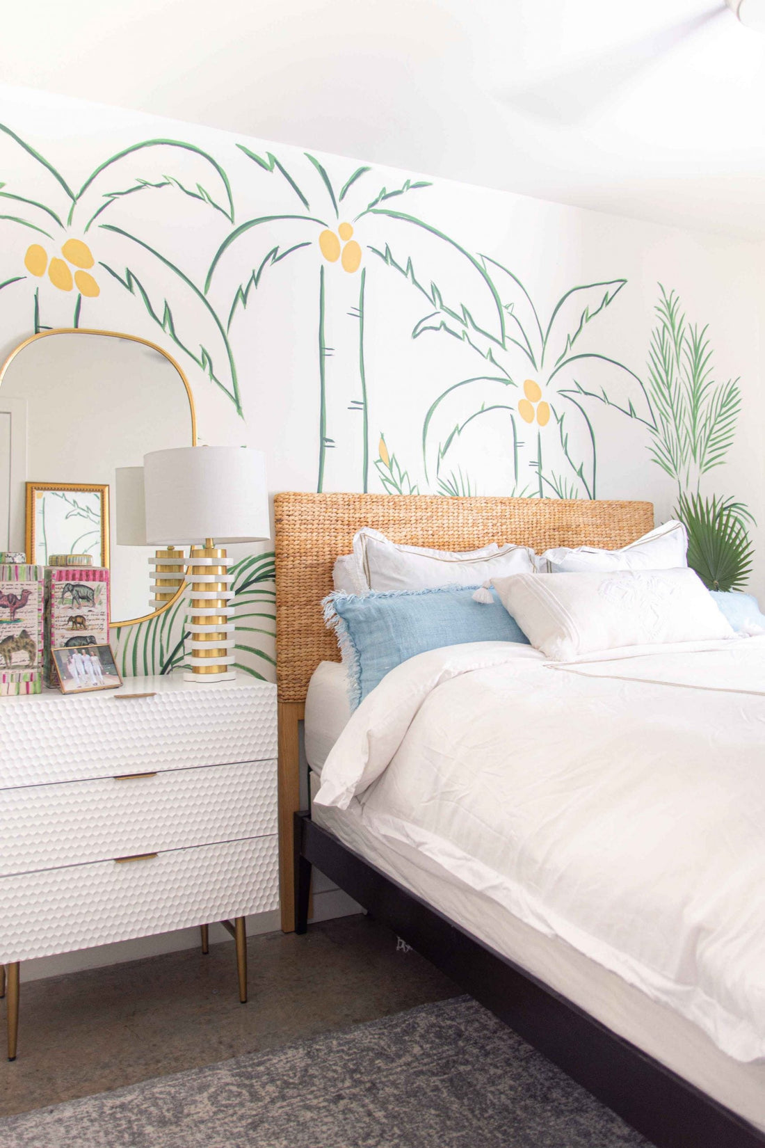 Hand-painted tropical wall mural with palm trees in green and white bedroom design by Kevin O'Gara on Thou Swell #wallmural #paintedmural #bedroomwall #bedroomdecor #bedroomdesign #tropicaldesign #tropicalwall #tropicalmural