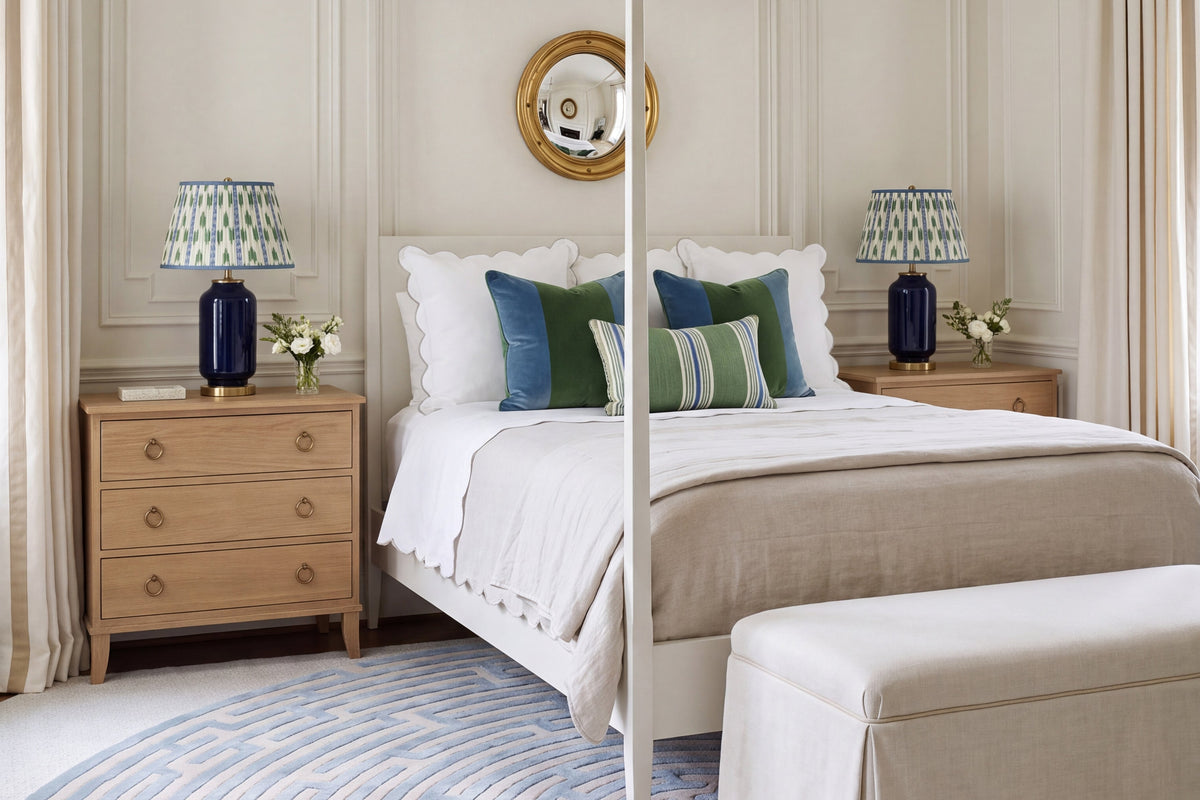 Blue and cream bedroom with a poster bed, round maze rug and Kevin Francis Design home decor