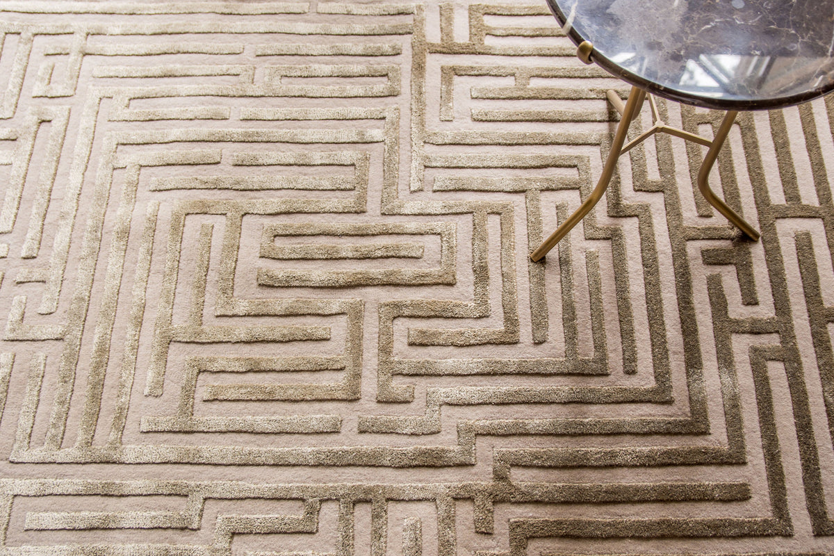 Hand-tufted wool Labyrinth maze rug by Kevin Francis Design in a living room