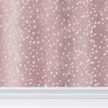 Contrado Wilde Spotted Antelope Hide wallpaper in Quartz Pink with a repeating pattern of spotted antelope design.