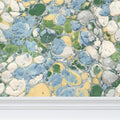 Blue and green Keats Pebble marbled wallpaper by Contrado, featuring a repeat pattern with textured marble-inspired design.