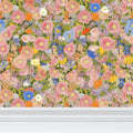 Repeat pattern floral wallpaper featuring petunia meadow design by Contrado, with colorful flower motifs on a light background.