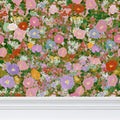 Primrose Meadow floral wallpaper with a repeat pattern featuring soft pastel flowers and greenery, by Contrado.