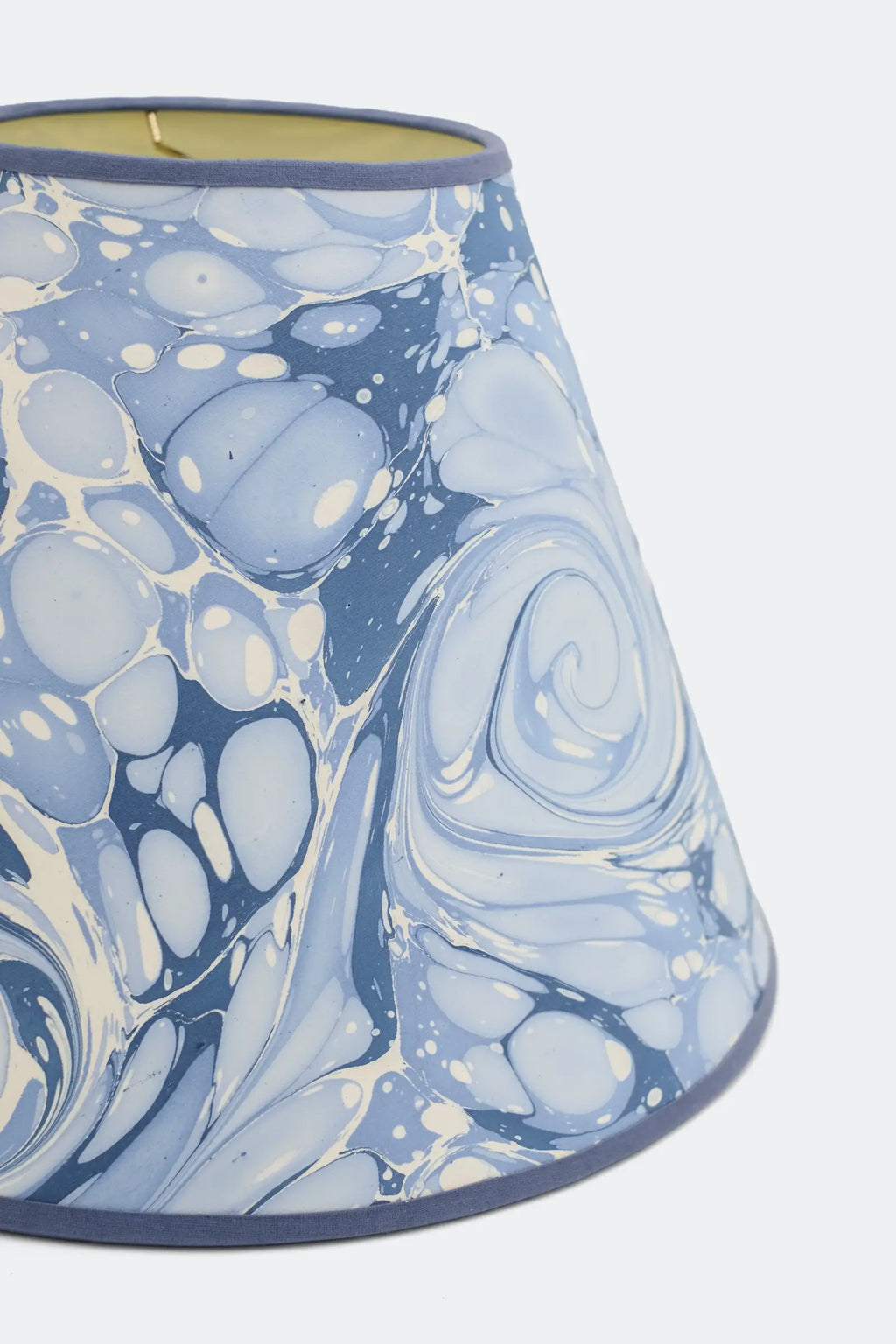 Close view of the Chiswick hand-marbled lamp shade showing the swirled blue and white marbled paper pattern.