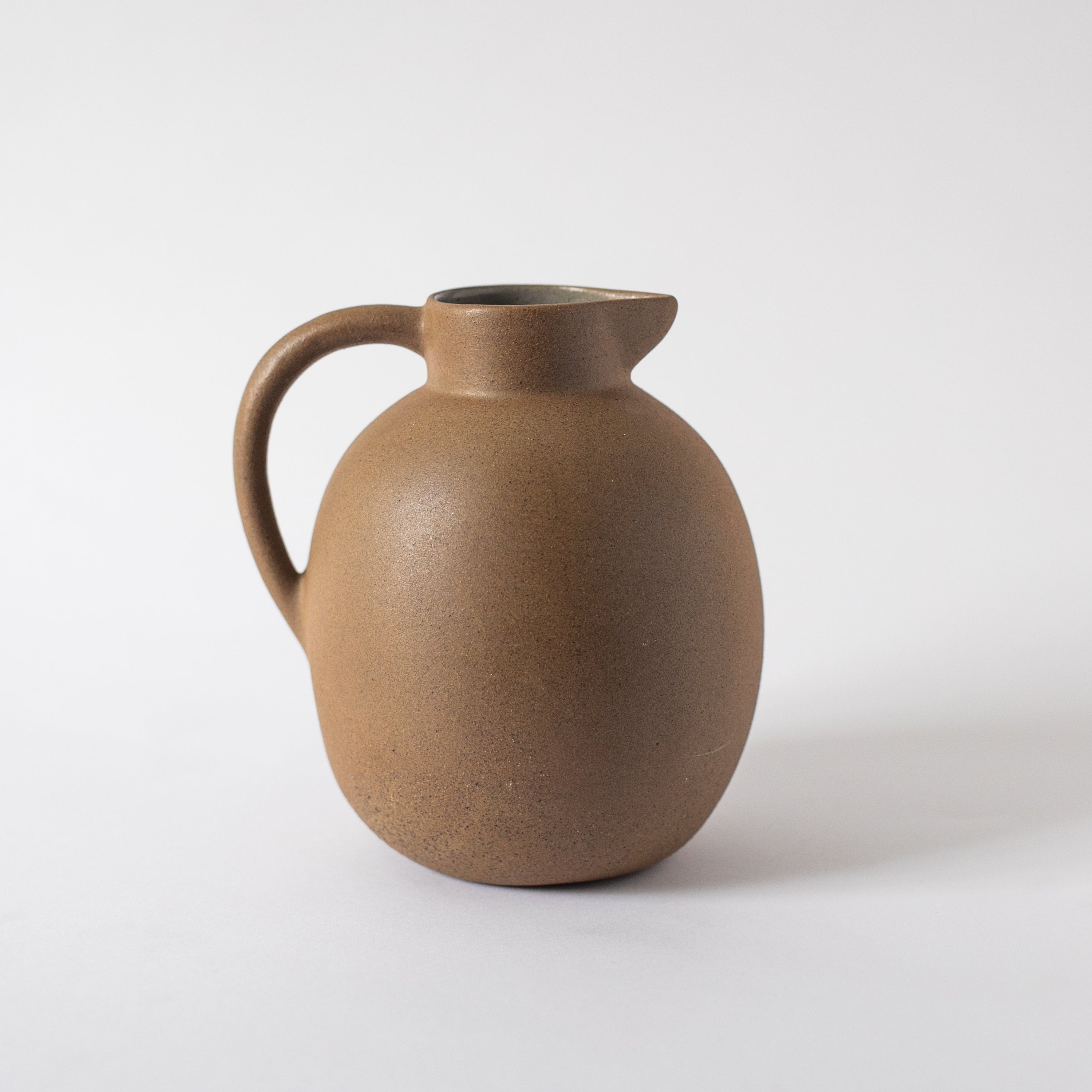 Handcrafted Clay Ball Pitcher by Kevin Francis Design | Luxury Area Rugs & Home Decor