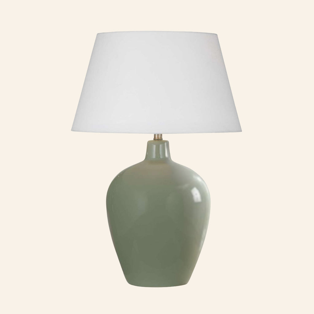 30-inch Ansley moss green glazed ceramic table lamp by Kevin Francis Design with a standard white hardback shade.