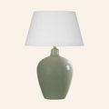 30-inch Ansley moss green glazed ceramic table lamp by Kevin Francis Design with a standard white hardback shade.