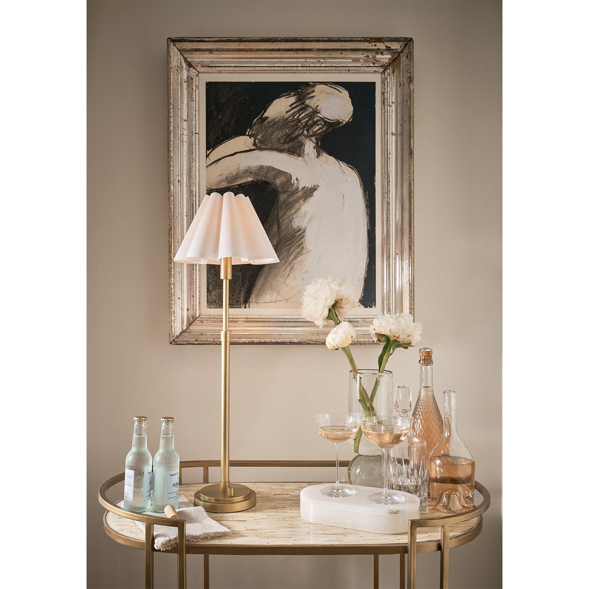 Detail of the Arabella cream scalloped linen shade and brass stem