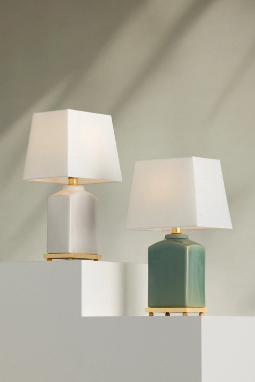 White ceramic 17-inch table lamp with a sleek design by Kevin Francis Design, featuring a modern and elegant appearance.
