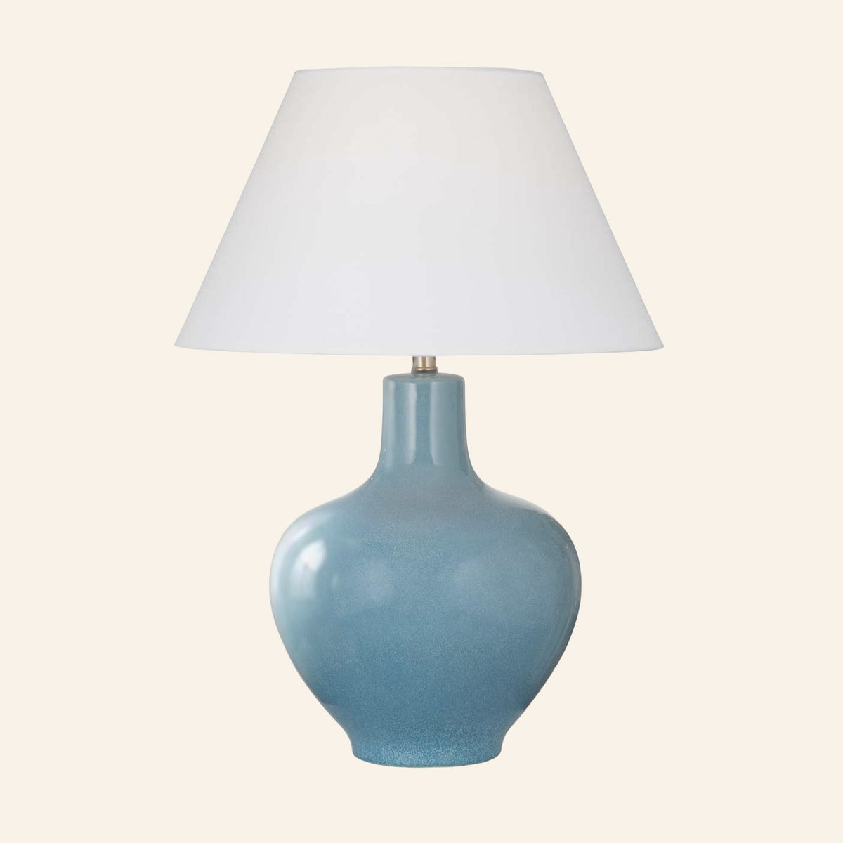Celeste aqua blue glazed ceramic table lamp with a standard white hardback shade.