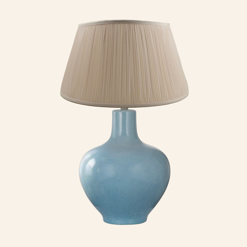 Celeste aqua blue glazed ceramic table lamp with a Park Taupe silk pleated shade.