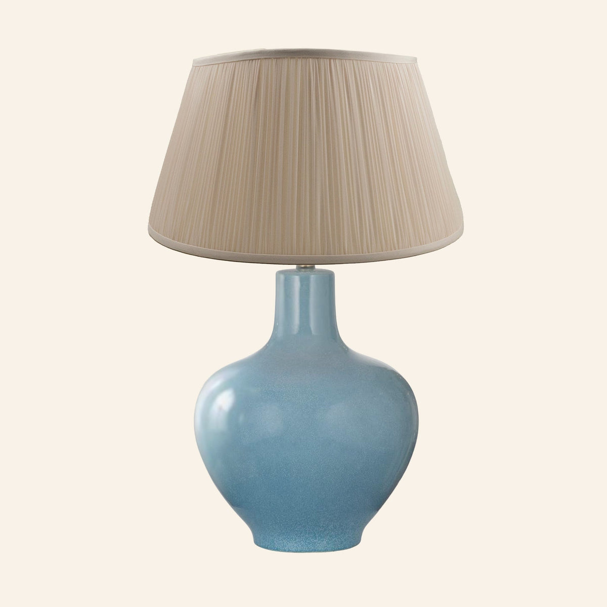 Celeste aqua blue glazed ceramic table lamp with a Park Taupe silk pleated shade.