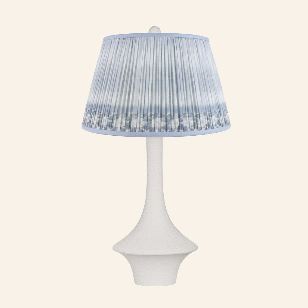 Constance matte white flared table lamp with a Coventry Blue ikat pleated shade.