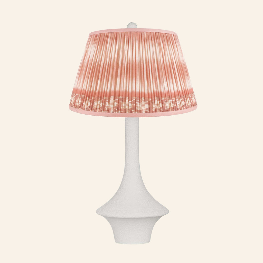 Constance matte white flared table lamp with a Coventry Coral ikat pleated shade.