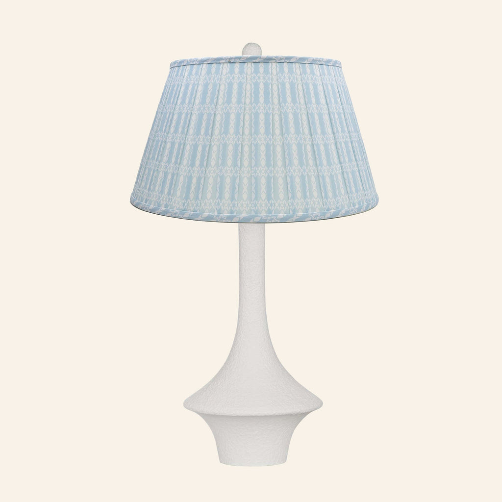Constance matte white flared table lamp with an Eastwood Blue print pleated shade.