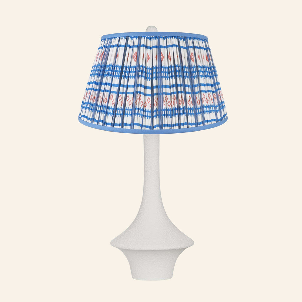 Constance matte white flared table lamp with a Fairfield blue and red print pleated shade.