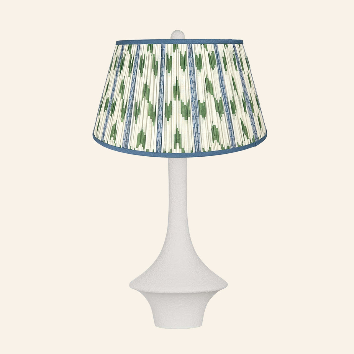 Constance matte white flared table lamp with a Millbrook blue and green ikat pleated shade.