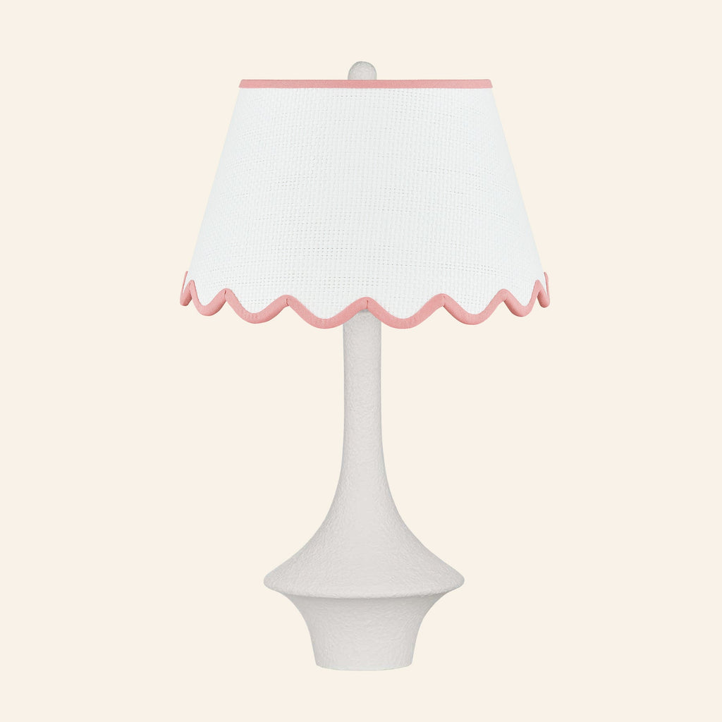 Constance matte white flared table lamp with a Pemberton Pink scalloped shade.