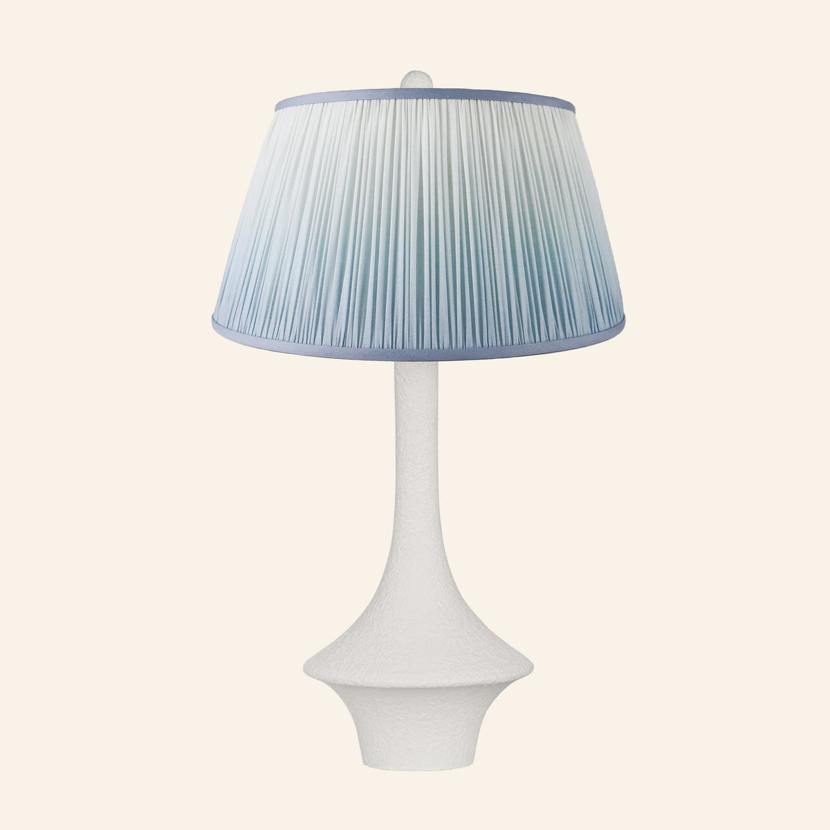 Constance matte white flared table lamp with a Vale Blue ombre pleated shade.