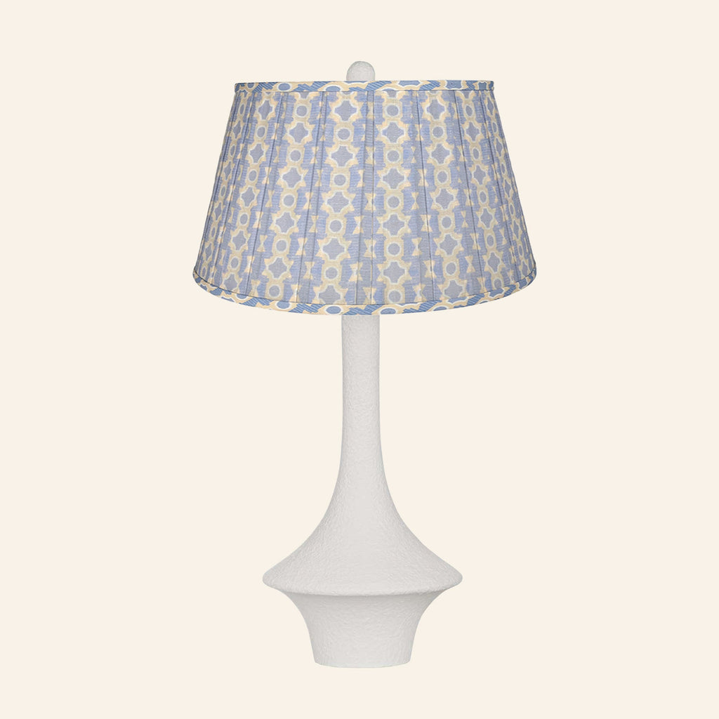 Constance matte white flared table lamp with a Willowbrook blue and tan print pleated shade.