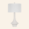 Constance matte white flared table lamp with a standard white hardback shade.