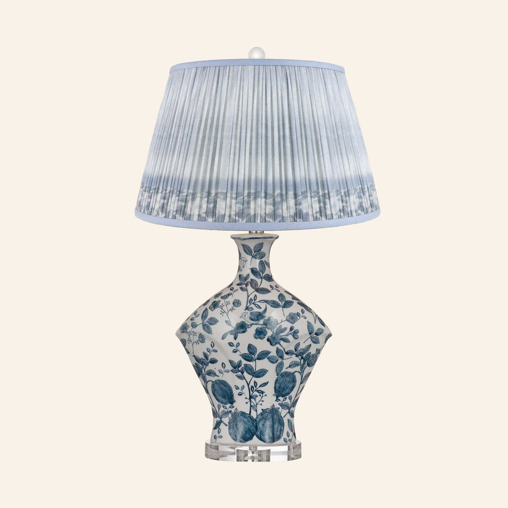 Georgiana blue and white chinoiserie ceramic table lamp with a Coventry Blue ikat pleated shade.