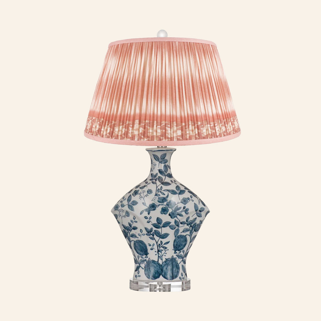Georgiana blue and white chinoiserie ceramic table lamp with a Coventry Coral ikat pleated shade.