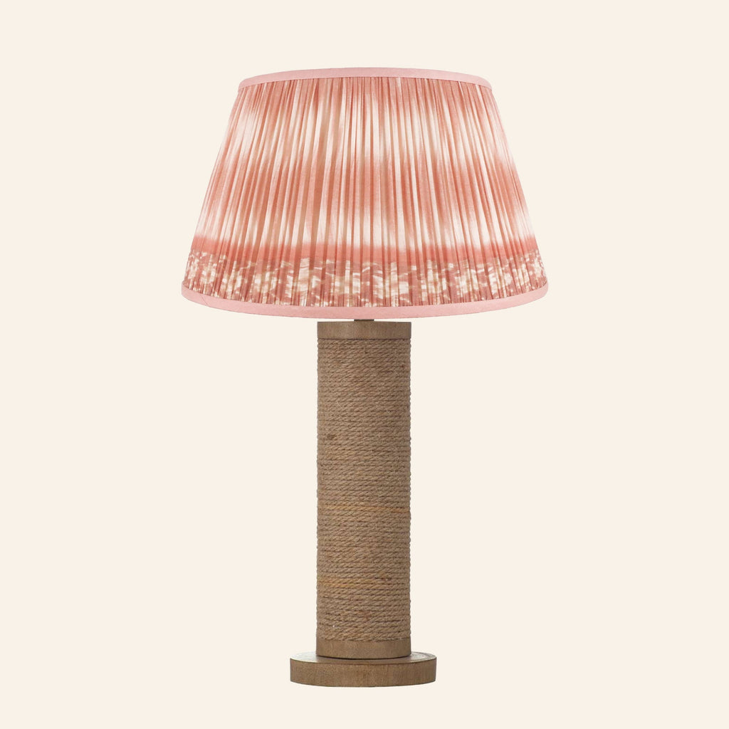 Harriet natural rope wrapped column table lamp with a Coventry Coral ikat pleated shade.