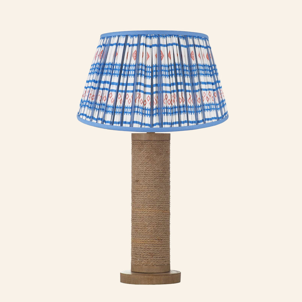 Harriet natural rope wrapped column table lamp with a Fairfield blue and red print pleated shade.