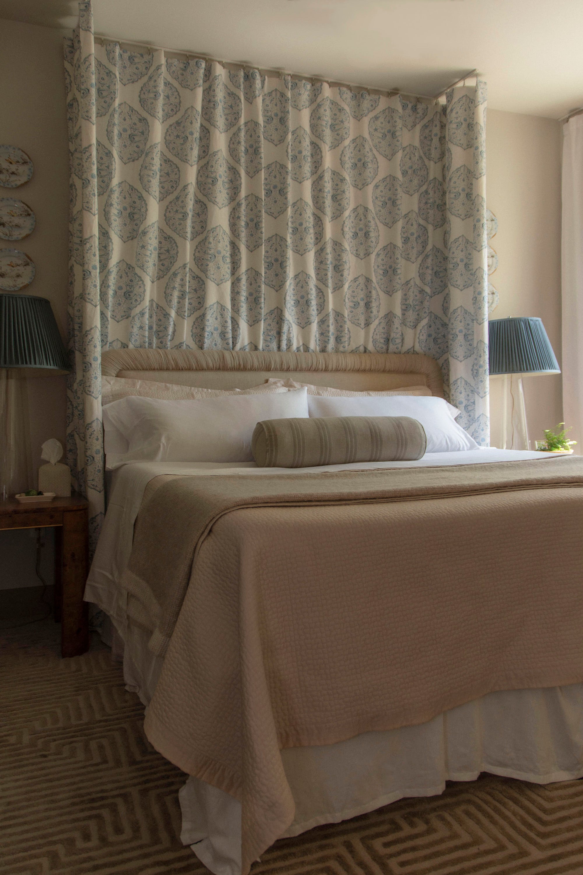 Linen upholstered rectangular headboard with gathered fabric pleated border by Kevin Francis Design