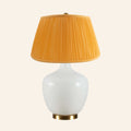 Sophia wide white glass table lamp by Kevin Francis Design with a sleek modern design and a wide base.