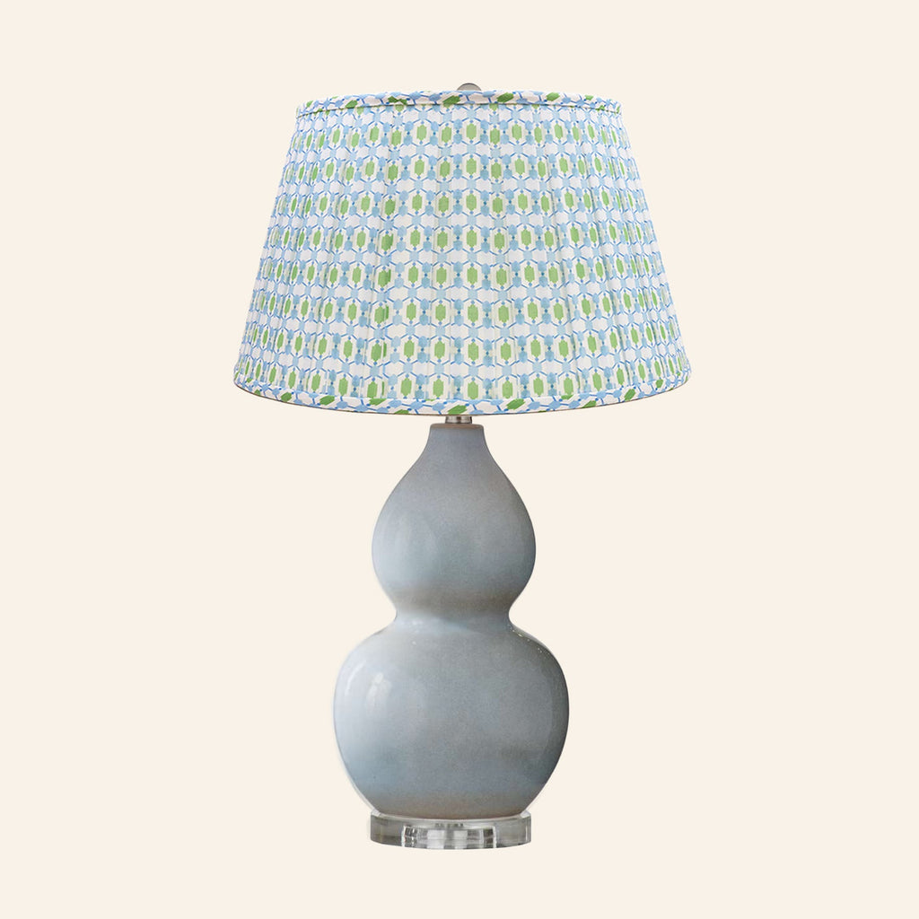 Vivienne gray blue double gourd ceramic table lamp with an Ashford blue and green print pleated shade.
