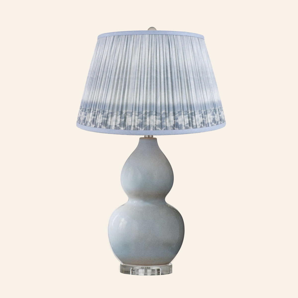 Vivienne gray blue double gourd ceramic table lamp with a Coventry Blue ikat pleated shade.