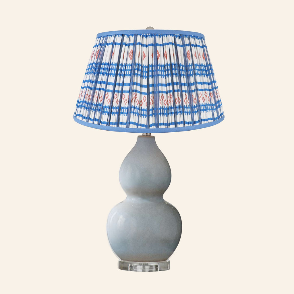 Vivienne gray blue double gourd ceramic table lamp with a Fairfield blue and red print pleated shade.