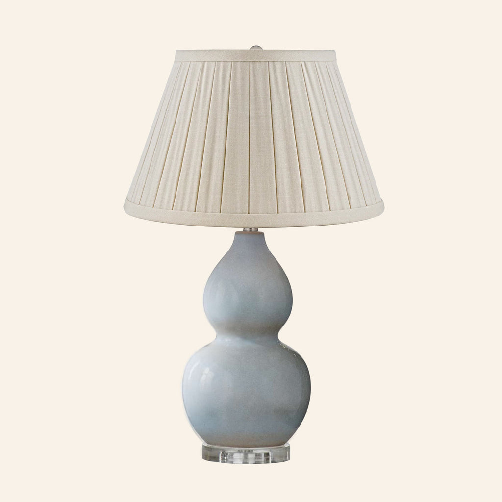 Vivienne gray blue double gourd ceramic table lamp with a Heath Cream linen box pleat shade.