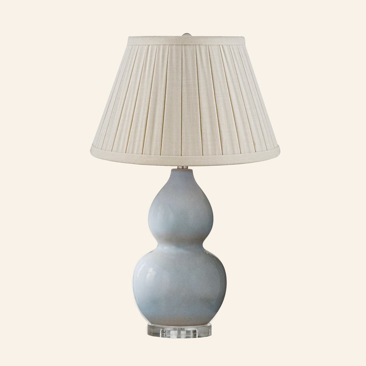Vivienne gray blue double gourd ceramic table lamp with a Heath Cream linen box pleat shade.
