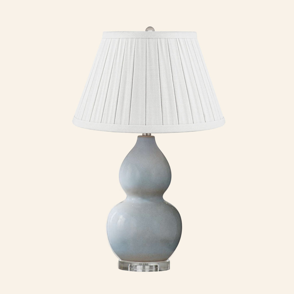 Vivienne gray blue double gourd ceramic table lamp with a Heath White linen box pleat shade.