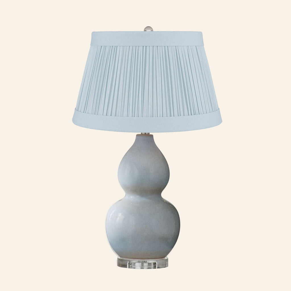 Vivienne gray blue double gourd ceramic table lamp with a Hill Blue linen pleated shade.