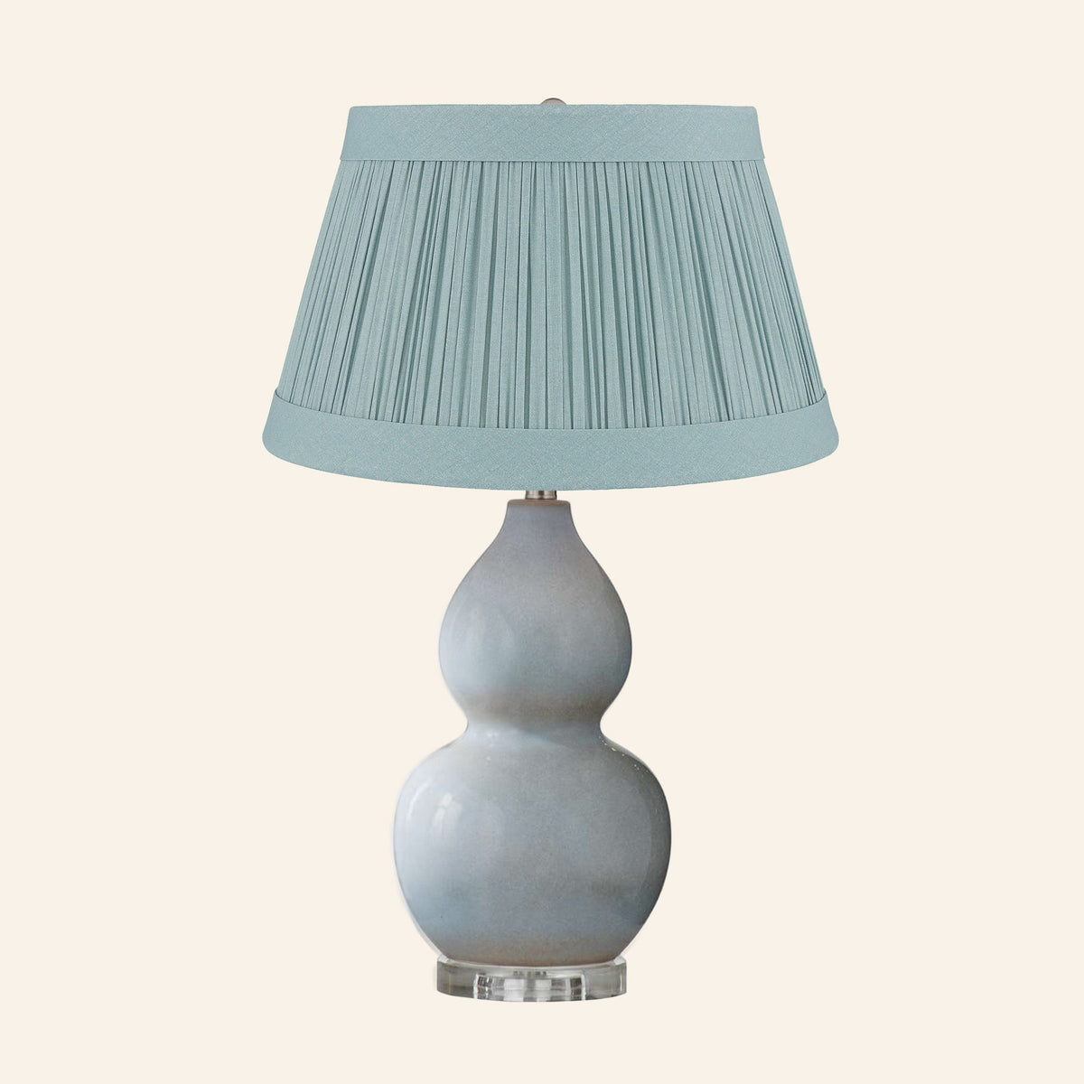 Vivienne gray blue double gourd ceramic table lamp with a Hill Teal linen pleated shade.
