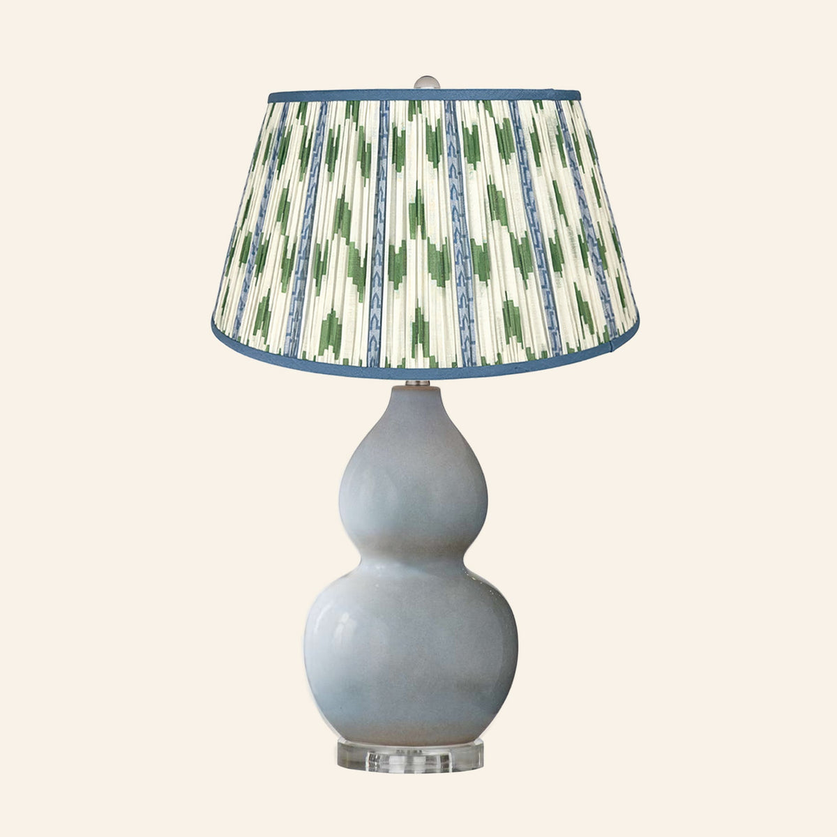 Vivienne gray blue double gourd ceramic table lamp with a Millbrook blue and green ikat pleated shade.