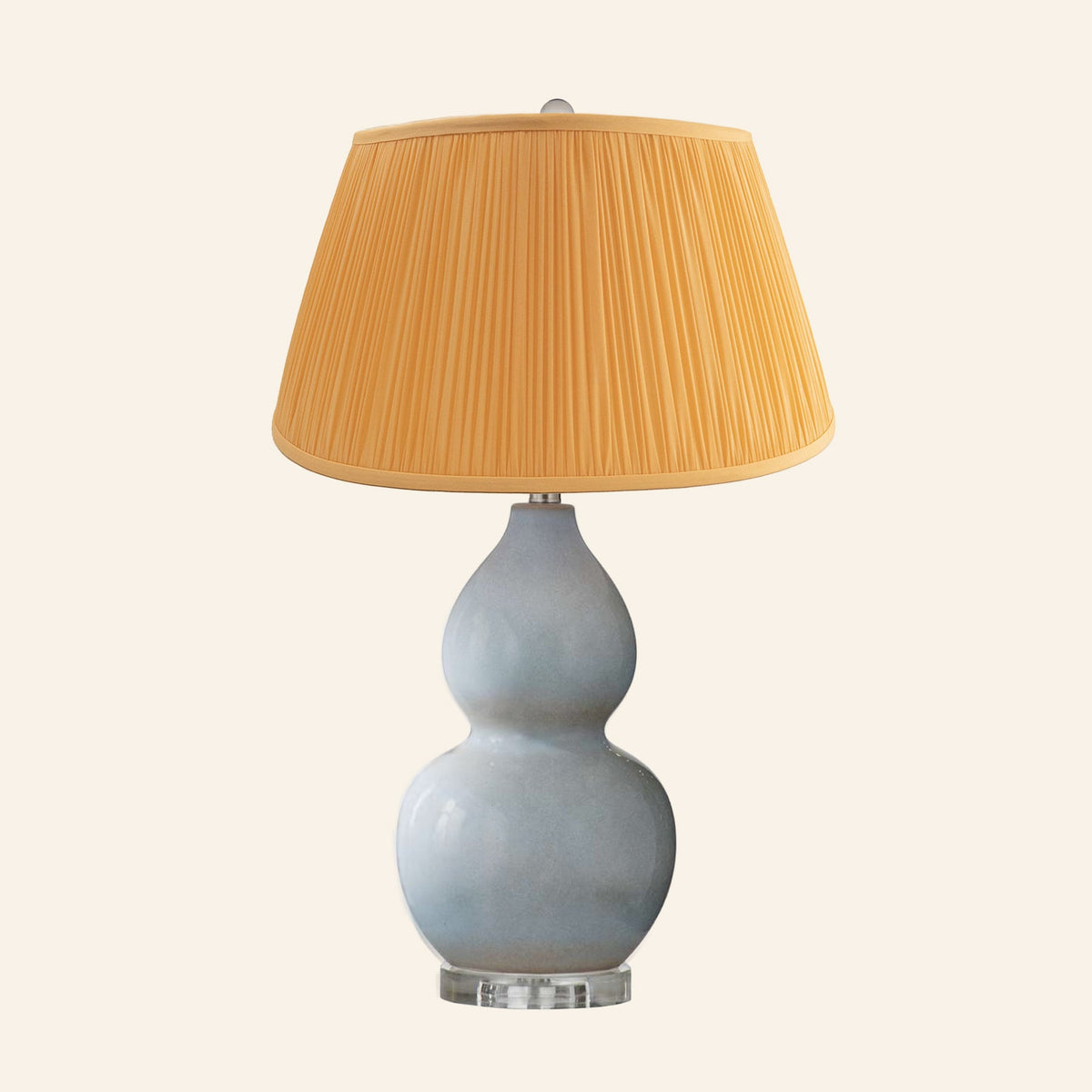 Vivienne gray blue double gourd ceramic table lamp with a Park Orange silk pleated shade.