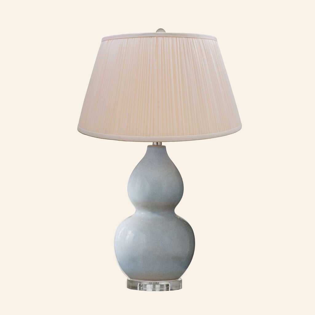 Vivienne gray blue double gourd ceramic table lamp with a Park Peach silk pleated shade.