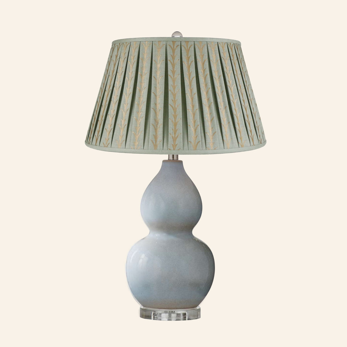 Vivienne gray blue double gourd ceramic table lamp with a Rosemary green and gold print pleated shade.