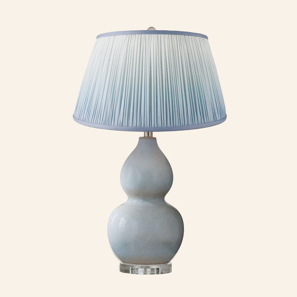 Vivienne gray blue double gourd ceramic table lamp with a Vale Blue ombre pleated shade.