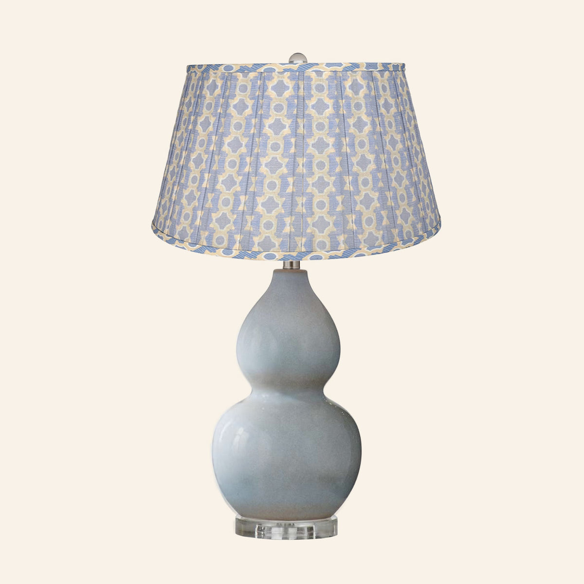 Vivienne gray blue double gourd ceramic table lamp with a Willowbrook blue and tan print pleated shade.