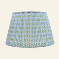 Blue and green printed pleated lampshade by Kevin Francis Design, showcasing a stylish and vibrant lamp shade.