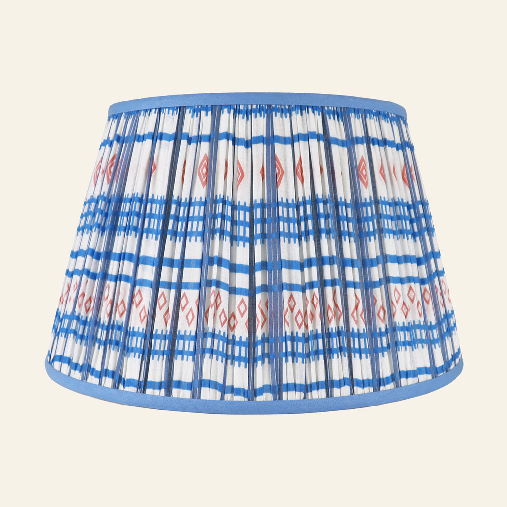 Blue and red printed pleated lamp shade by Kevin Francis Design, showcasing intricate pattern and elegant pleats.